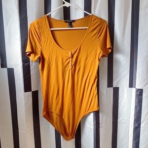 RUST ORANGE SHORT SLEEVE BODY SUIT WITH SILVER BUTTONS